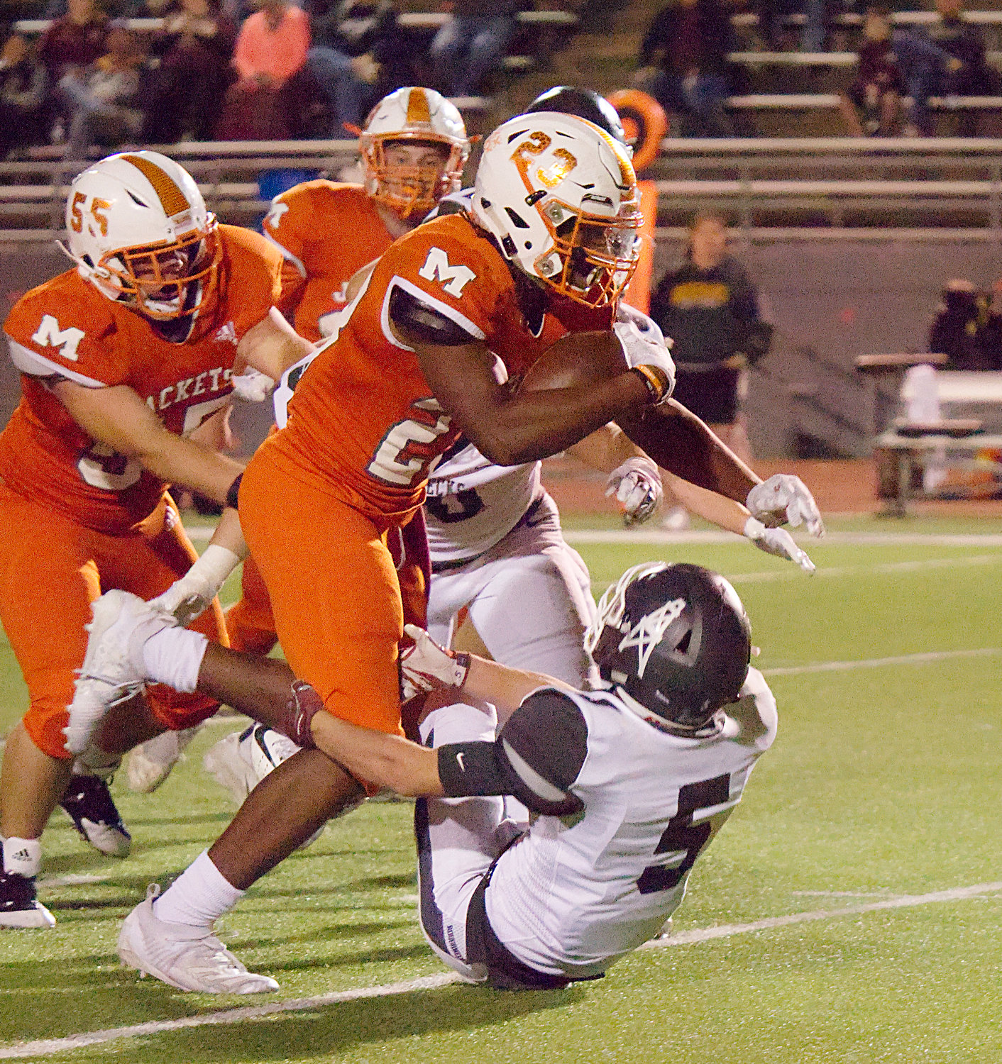 Sneed runs over a Roughneck defender against White Oak on Oct. 18, 2019 in Mineola.